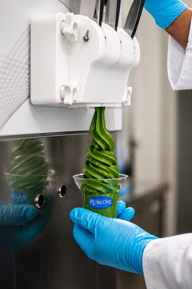 Matcha soft serve being drawn from a Rubicone soft serve machine